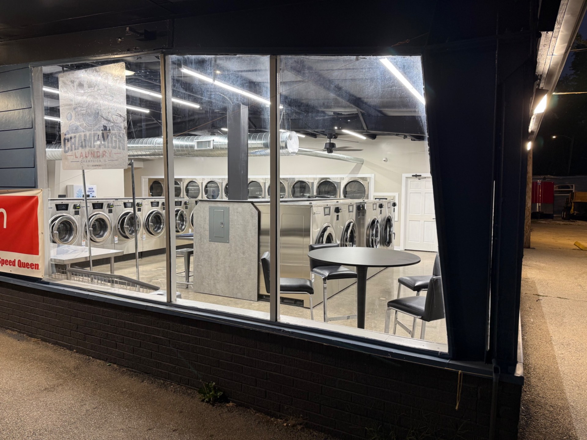 View through the storefront windows into Champaign Laundry